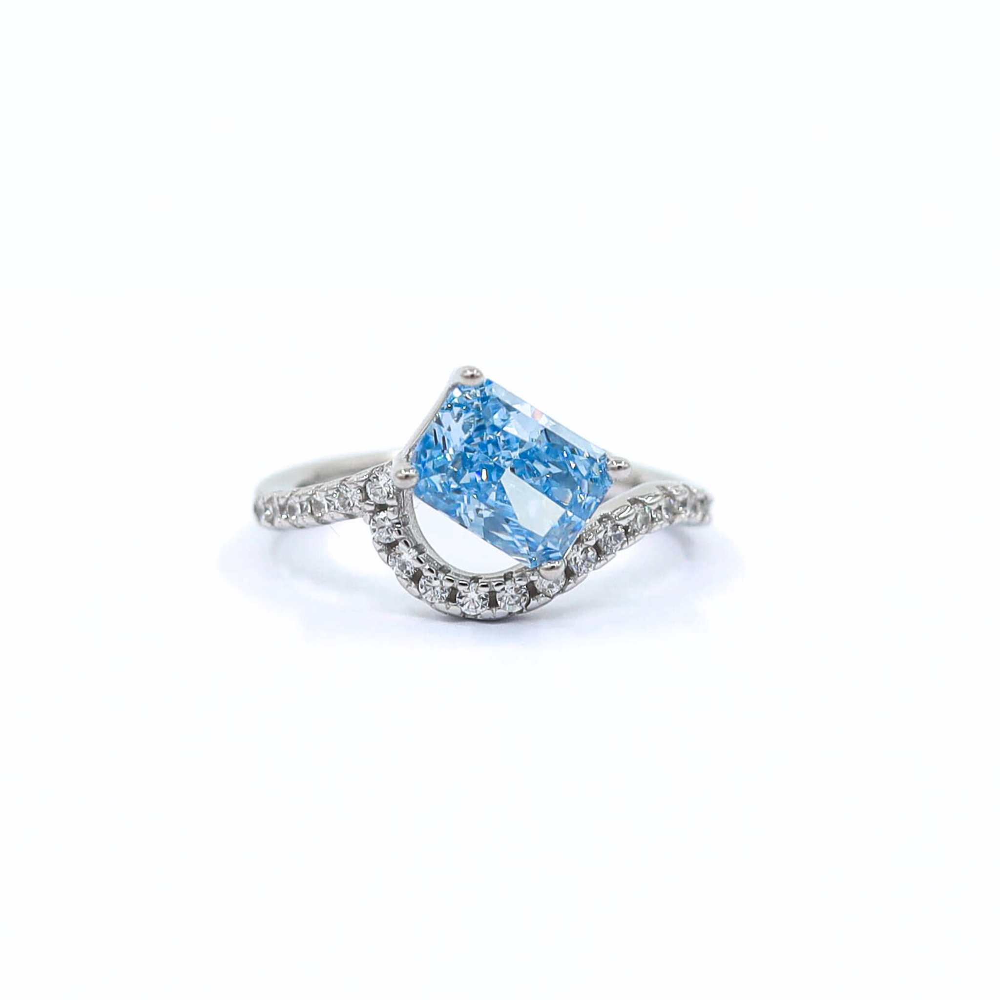 Ring Blue waterSterling Silver ring with a blue rectangular stone in the middle, with white stones all over the wavy band