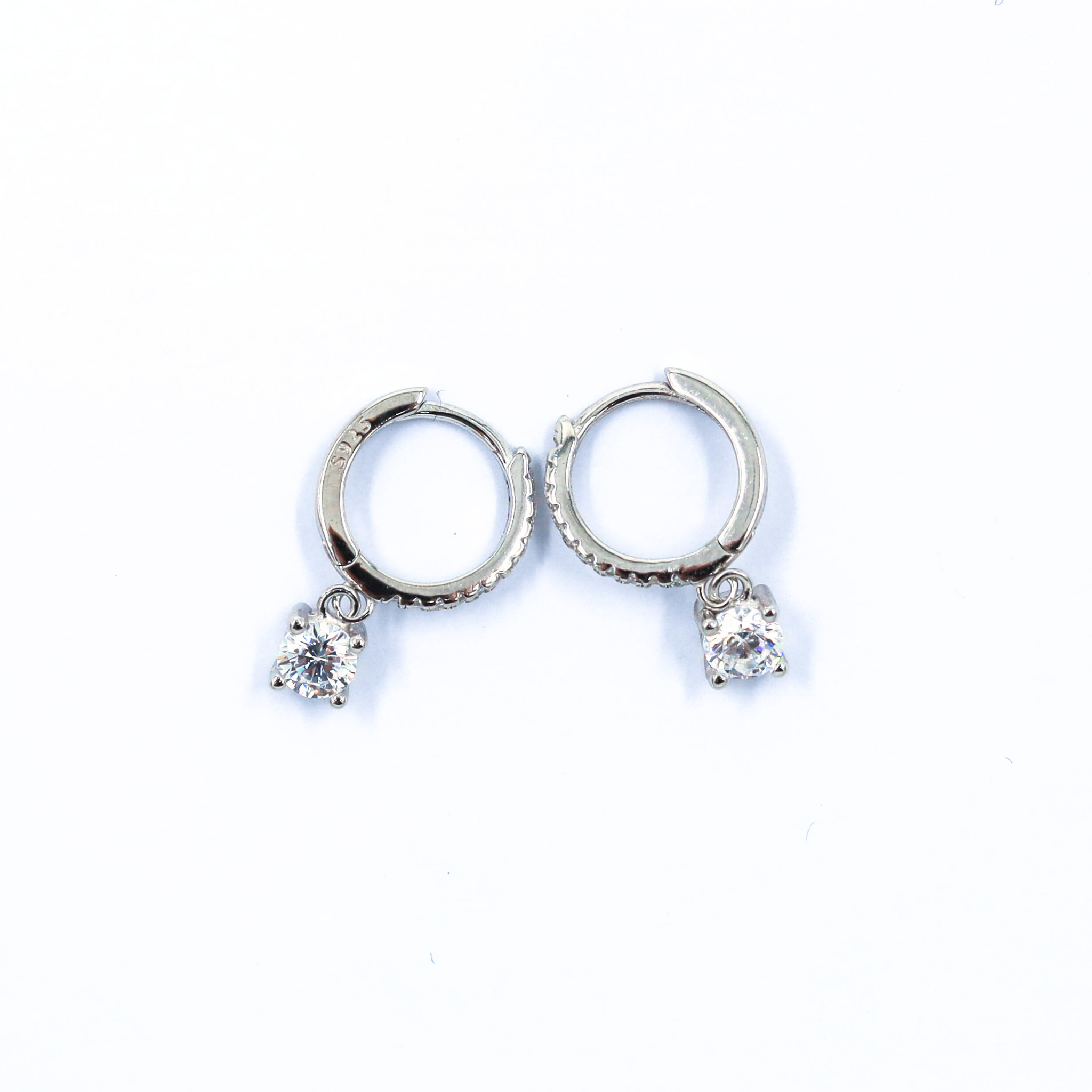 Hoop Earrings in silver, showcased on a white background
