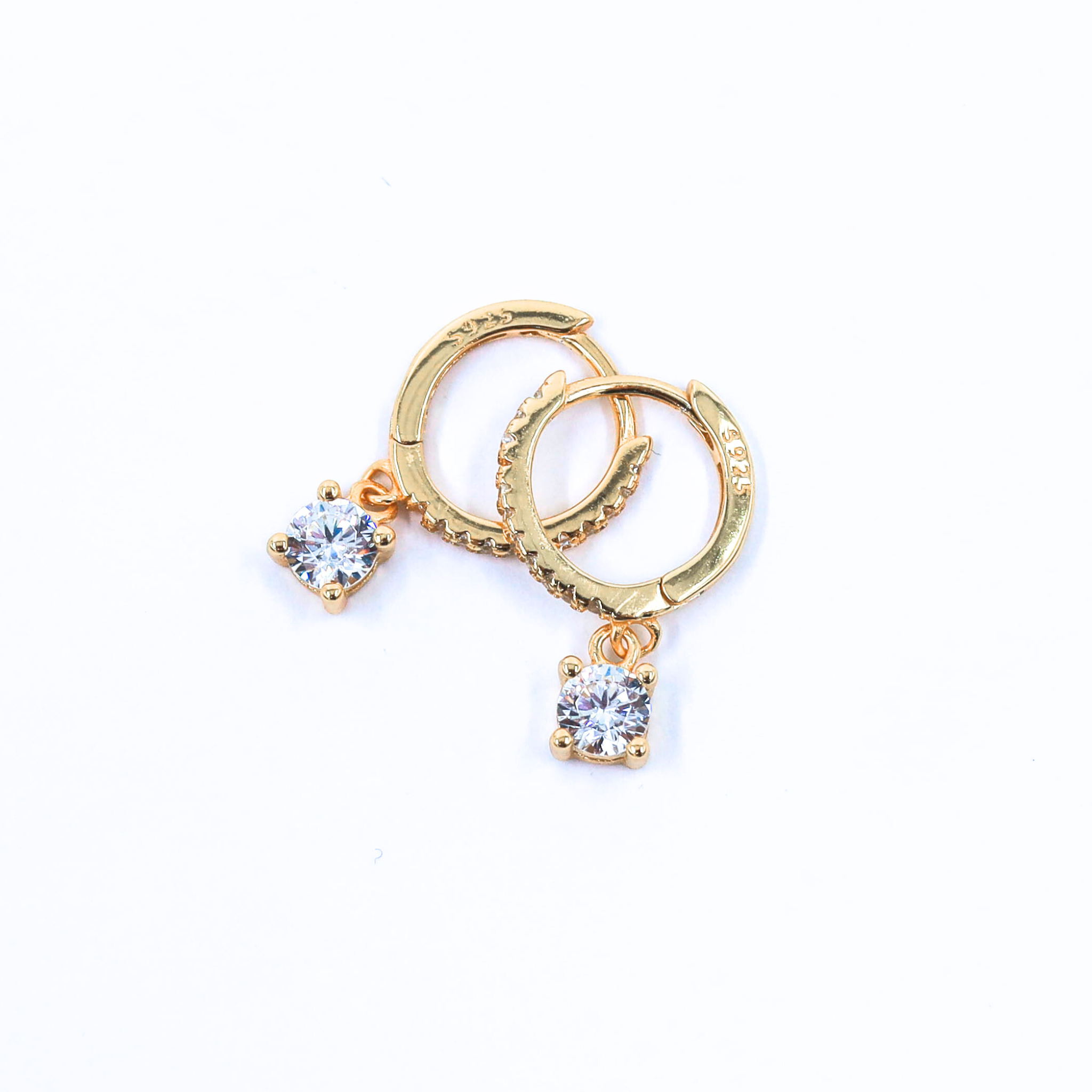 Hoop Earrings made of sterling silver, gold plated, overlapped, showcased on a white background
