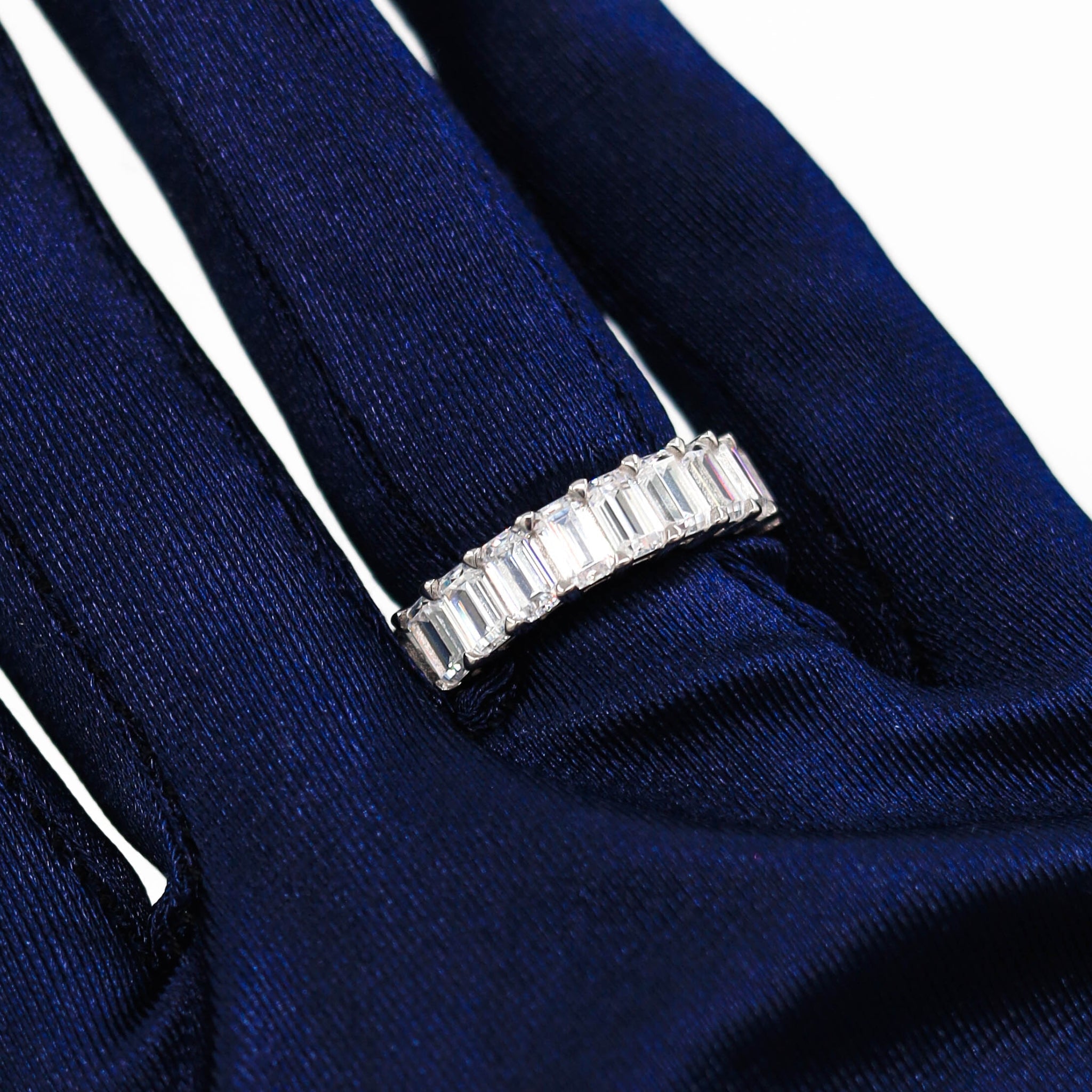 Close-up of the Crystal Garden Geometric Ring, highlighting its sterling silver band with rhodium plating and dazzling clear cubic zirconia stones set in a contemporary geometric arrangement.