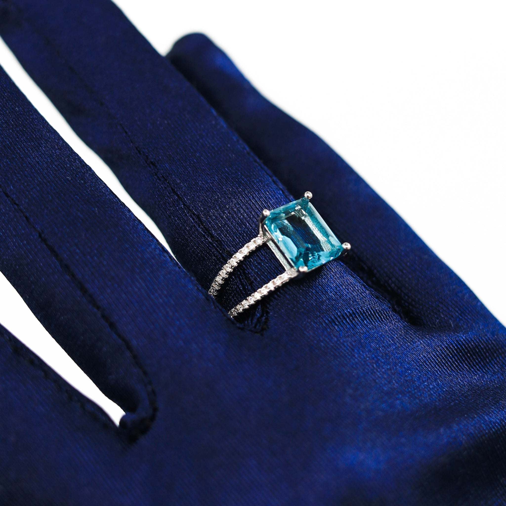 Blue Rectangular Ring worn on finger, highlighting the vibrant blue rectangular gemstone and polished sterling silver band for a contemporary and sophisticated look. Rhodium plated