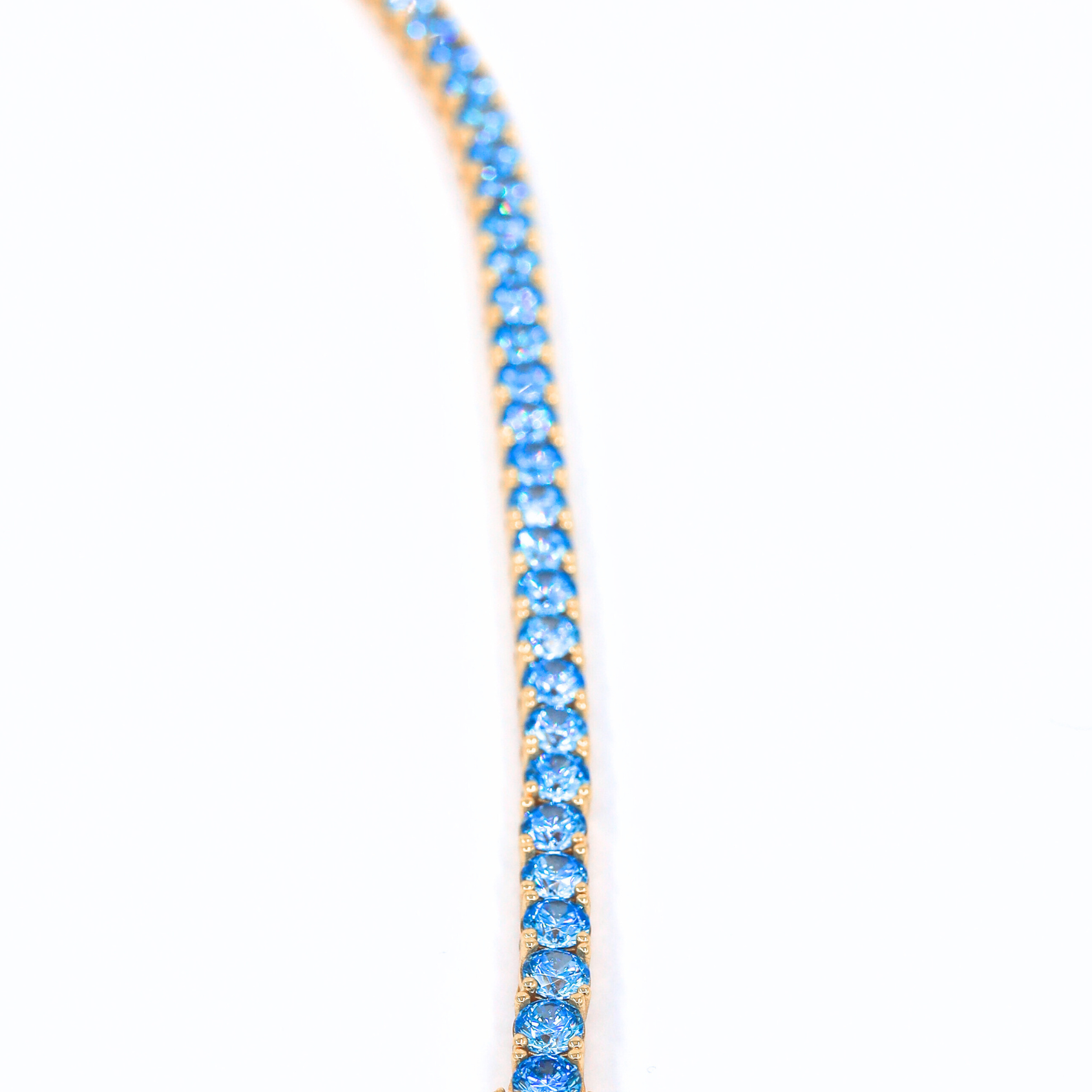 Aqua Dream Tennis Bracelet-Blue 925 silver tennis bracelet gold plated, showcased on a white background