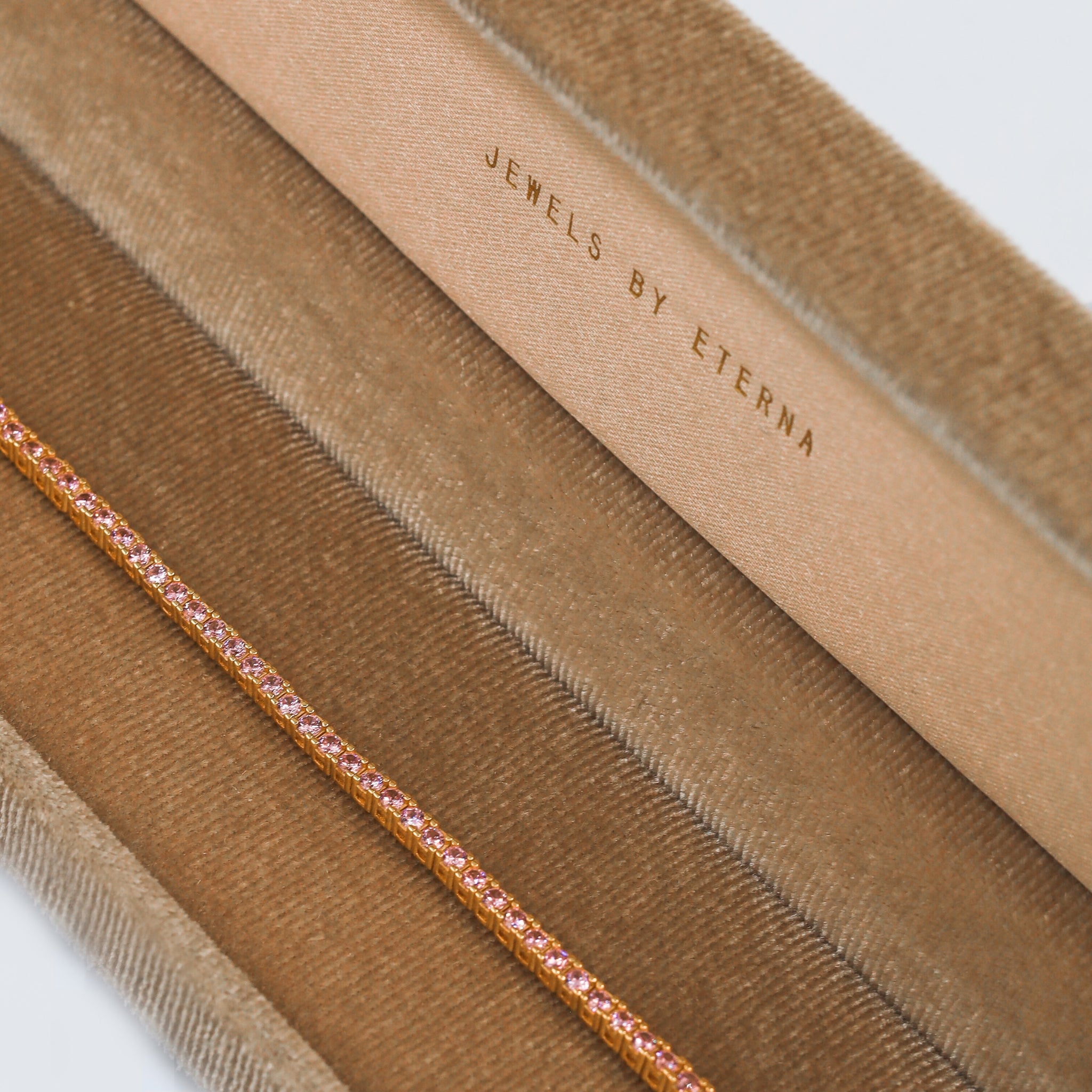 Tennis Bracelet Rose featuring sparkling round cubic zirconia stones set in a luxurious rose gold-plated band, offering a refined and radiant design. Gold plated. The bracelet is carefully put inside our luxurious velvet packaging boxes