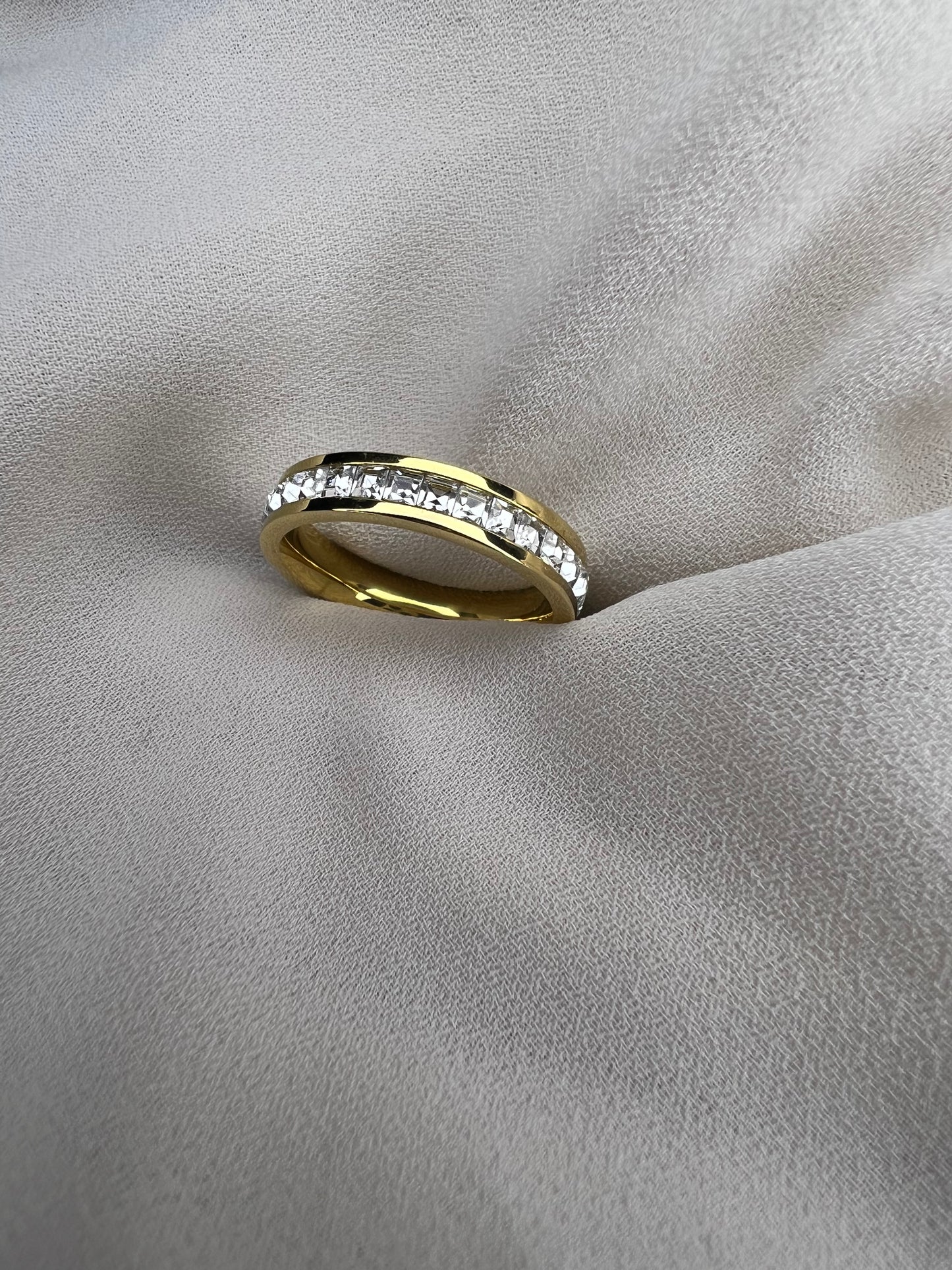 "18K gold-plated ring featuring a delicate leaf design, crafted from stainless steel and adorned with cubic zirconia stones. A unique and elegant piece by Jewels By Eterna."
