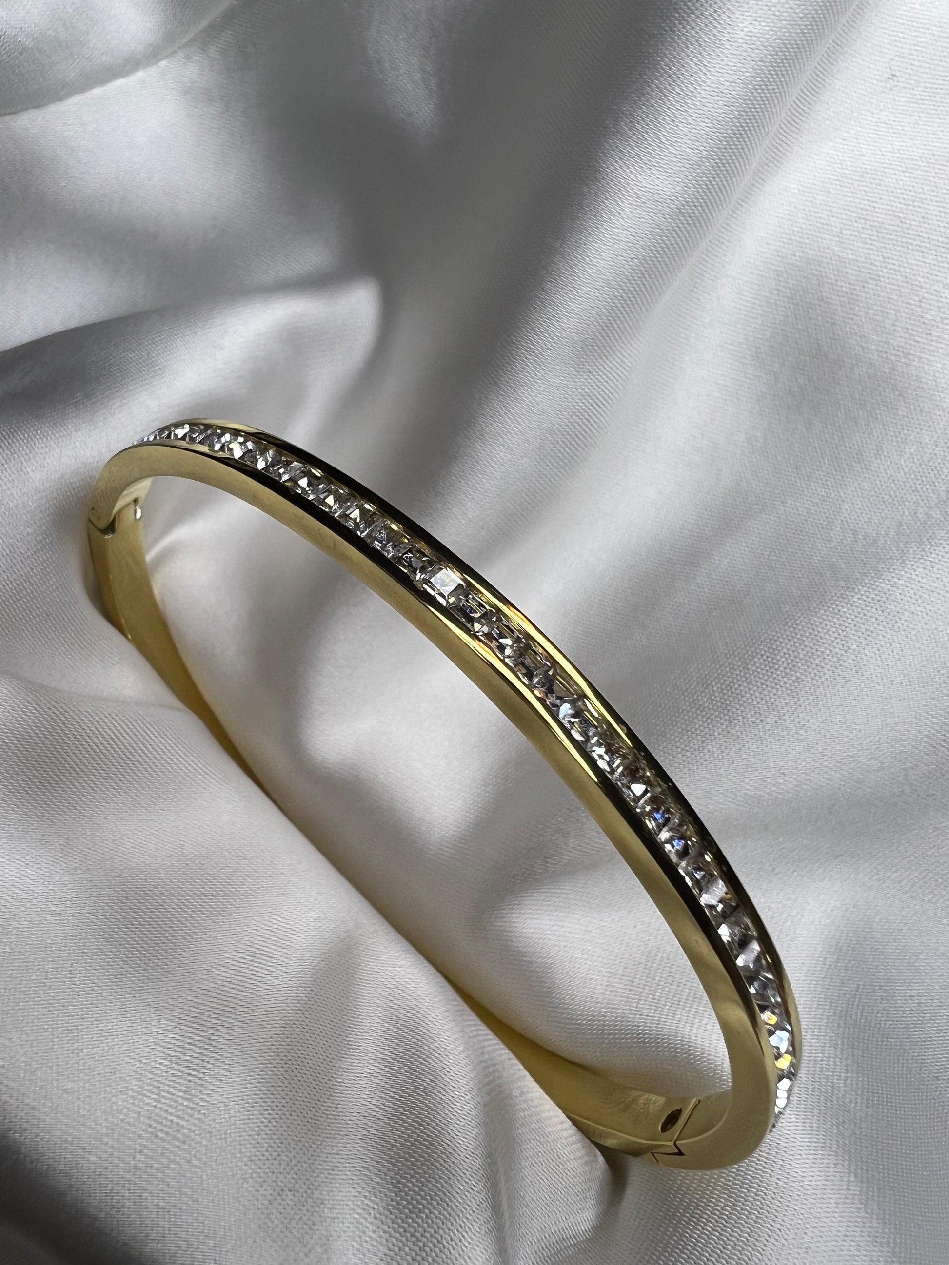 18K gold plated, stainless steel solid bracelet, with small square white cubic zirconia stones 