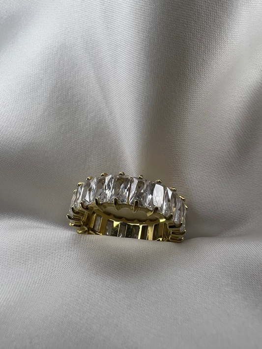 18K gold-plated ring with a unique, rectangular shape. Crafted from stainless steel and adorned with cubic zirconia stones for added elegance. 